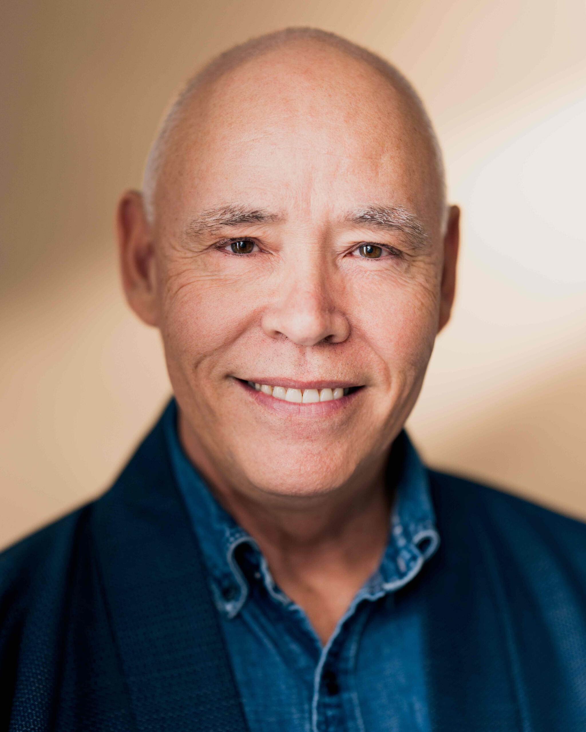 Headshot of keynote speaker Tim Tamashiro in 2025, smiling confidently against a clean background.